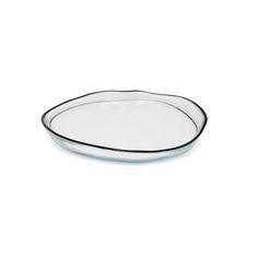 an oval glass plate with black rim on a white background, it is empty and ready to be used as a serving dish