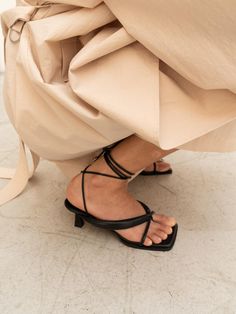 - Square toe- Self-tie strappy sandal- Bold flip flop strap- French mid heelMeasurements- Heel: 2.3- Size: KR225(US5.5)-KR250(US8)- This item is based on the KR shoe size. Please refer to the size chart.- This item runs true to size. For wide feet, please order half size larger than your normal size.Composition & Care- Upper: Sheep leather- Midsole: Sheep Leather- Insole: Synthetic LeatherDesigner- Made in Korea- by CHIELEI- Style#: 300905777 Evening Toe Post Sandals With Heel Loop, Summer Strappy Lace-up Sandals With Sculpted Heel, Chic T-strap Sandals With Heel And Toe Post, Chic T-strap Sandals With Heel Strap, Formal Sandals With Wrapped Heel And Toe Post, Summer Strappy Sandals With Reinforced Heel, Summer Sandals With Reinforced Heel And Strappy Design, Chic Toe Ring Sandals With Heel Strap, Chic Strappy Lace-up Sandals With Heel Loop