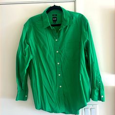 Brand New. Never Worn Kelly Green Button Down Shirt. Size Medium Classic Gap Tops For Spring, Gap Work Shirt With Button Cuffs, Gap Shirt With Button Cuffs For Workwear, Gap Button-up Workwear Shirt, Gap Button-up Shirt For Work, Spring Gap Shirt With Button Closure, Gap Summer Workwear Shirt, Gap Cotton Button-up Blouse, Green Button-up Office Shirt