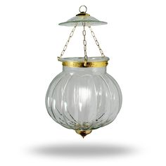 a clear glass hanging light with gold trim