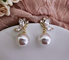 Swarovski Pearl Bridal Earrings, CZ Crystal Bridal Earrings, Drop Wedding Earrings, Gold Champagne White Earrings Wedding Bride Jewelry  Ready to Ship!  Amazingly Beautiful! Lots of Sparkle!  Add a breathtaking touch to your wedding dress with this glamorous and one of the kind bridal earrings! Gorgeous and stunning, these gold-plated bridal earrings are made with marvelous Swarovski pearls and AAA grade Cubic Zirconia crystals. They would look fabulous for your wedding, party, prom and any spec Wedding Earrings Gold, Drop Pearl Earrings, Pearl Bridal Earrings, Wedding Bride Jewelry, Crystal Bridal Earrings, Bridal Earrings Drop, Wedding Earrings Drop, Bride Jewelry, Gold Champagne