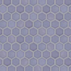 an abstract hexagonal tile pattern in purple and white