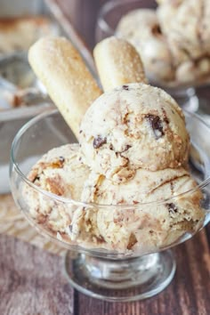 a glass bowl filled with ice cream and cookies