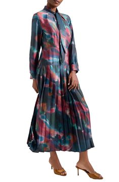 A drapey tie-neck detail tops this long-sleeve maxi dress boasting a dropped waist and a brilliantly pleated skirt on sumptuous crêpe de Chine. Fold-over tie neck Long sleeves with button cuffs 100% polyester Hand wash, line dry Imported Long Sleeve Multicolor Silk Maxi Dress, Multicolor Silk Long Sleeve Maxi Dress, Multicolor Silk Maxi Dress With Long Sleeves, Spring Silk Long Sleeve Maxi Dress, Spring Silk Maxi Dress With Long Sleeves, Flowy Silk Long Sleeve Maxi Dress, Flowy Silk Maxi Dress With Long Sleeves, Teal Maxi Dress, A Line Maxi Dress