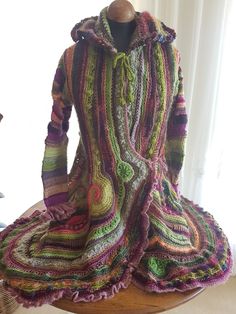 a crocheted dress is sitting on a table