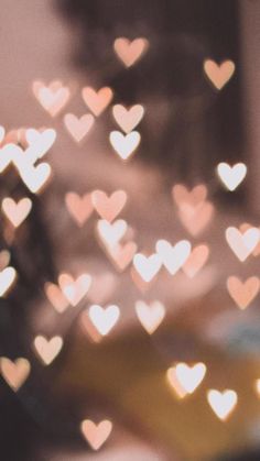 blurry image of many hearts in the shape of heart shapes on a blurred background