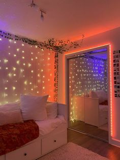 a bedroom with lights on the walls and a bed