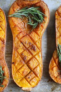 baked butternut squash with rosemary sprigs on top and the words smoked butternut squash