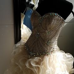 a dress on display in front of a mirror