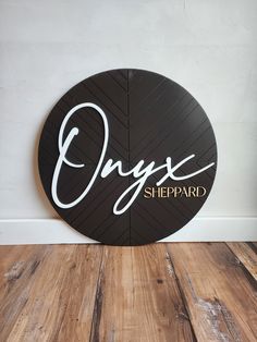 a black and white sign that says onyx sheeppard in cursive writing