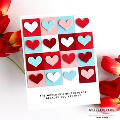 a card with hearts on it next to red flowers and tulips that say, the world is a better place because you are in it