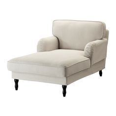 a white chaise lounge chair with black legs