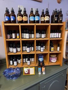 a shelf filled with lots of different types of bottles