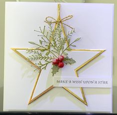 a star shaped card with some flowers on it