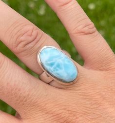 Show off your love of tranquility with this gorgeous Larimar ring. The oval blue Larimar ring brings peace, healing and tranquility to the wearer. This stone is known to increase intuition and calm one's disposition. Larimar crystals are said to enlighten and heal in a physical, emotional, mental & spiritual way! It stimulates the heart, throat, third eye, and crown chakras facilitating inner wisdom and outer manifestation. It represents peace and clarity, radiating healing and love energy. This Larimar Crystal, Increase Intuition, Island Blue, Larimar Ring, Larimar Rings, Inner Wisdom, Larimar Stone, Blue Stone Ring, Love Energy