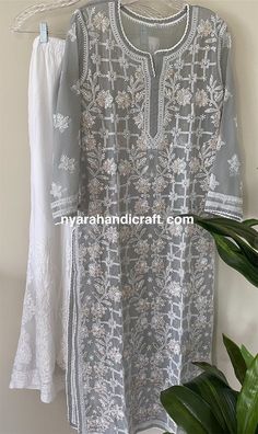 "Beautiful gray hand embroidered Chikankari kurta with gota patti add ons! Team it with Chikankari palazzo and chiffon Dupatta to complete the look! \"Embroidery Designs may vary\" Kurta Length : 48 inches Palazzo Length : 40 inches Elastic waistband: One Size" Festive Embroidered Gray Dupatta, Gray Resham Embroidery Dupatta For Diwali, Traditional Gray Salwar Kameez With Dupatta, Gray Chikankari Embroidery Traditional Sets, Traditional Gray Chikankari Embroidery Sets, Gray Traditional Sets With Chikankari Embroidery, Gray Resham Embroidery Kurta For Wedding, Traditional Gray Kurta For Diwali, Festive Gray Kurta With Dupatta