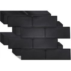 black brick tiles are arranged in the shape of an arrow, on a white background