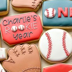 decorated cookies with baseball, mitt, and glove on top of each cookie is the name charlie's rockie year