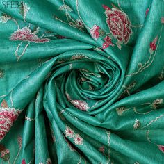 Pure Tussar Silk Embroidered Fabric by the yard Indian Embroidery Raw Wild Natural Handmade Silk Fabric Peace Silk | Tussah Silk | Raw Silk  ➤Material: Pure Tussar Silk 70gsm ➤ Color: Red, Pink and White Cross stich Embroidery on Sea Green Pure Tussar Silk Fabric. ➤ Width: 44 Inches ➤ Code: sfe34 ➤ Listing for 1 yard of fabric.  This is a 100% tussar silk. It is hand reeled and handwoven. The beautiful texture of the fabric uneven ridges and imperfect weaving makes it super special, and its shines gets softer while remaining strong and resilient throughout its life. You can use this fabric for clothing, kurta's, crafty projects, patchwork, blouses, dresses, lampshades etc. Wash & Care/Fabric Handling Instructions: ➤Do not wash ➤Iron at Medium Heat ➤No Steam Iron ➤Dry Clean only ➤Hang Under Green Floral Embroidered Fabric For Eid, Eid Green Floral Embroidered Fabric, Green Intricate Embroidered Fabric For Eid, Green Embroidered Fabric For Eid, Green Intricate Embroidery Fabric For Eid, Green Floral Embroidered Fabric For Festive Season, Green Floral Embroidered Raw Silk Fabric, Green Raw Silk Fabric With Floral Embroidery, Unstitched Green Raw Silk Embroidered Fabric