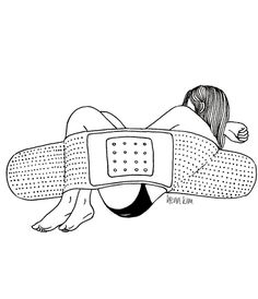 a woman laying on top of a pillow with an electronic device attached to her back