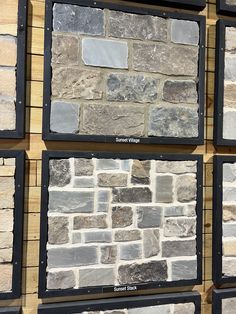 several different types of stone are displayed on the wall