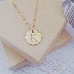 "Heads or tails? You can't go wrong with our mini coin necklace - it's a jewellery box treasure! This yellow gold vermeil disc charm measures 12mm across the front of the disc, perfectly sized for a central engraved initial. The disc charm is secured with a yellow gold vermeil jump ring and moves freely on a dainty yellow gold vermeil belcher chain in a length of your choosing, with a lobster clasp fastening at the back. Our yellow gold vermeil belcher chain lengths range from 16\", which falls Heads Or Tails, Personalised Jewellery, Engraved Initials, Gold Vermeil Jewelry, Rainbow Necklace, Keepsake Jewelry, Vermeil Jewelry, Exclusive Jewelry, Engraved Items