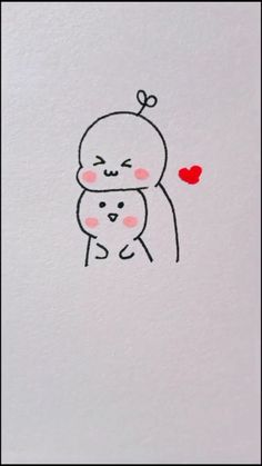 a drawing of two cats hugging each other on a piece of white paper with pink eyes