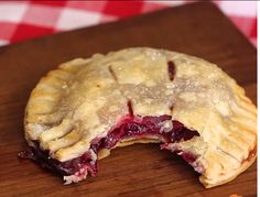 a close up of a pie on a cutting board