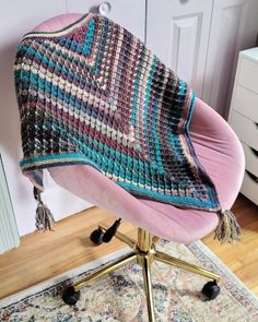 a chair with a blanket on top of it