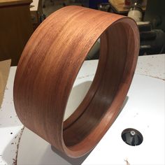 a wooden ring sitting on top of a table