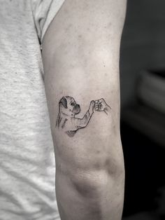 a person with a tattoo on their arm