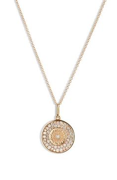 This handmade necklace promises plenty of shine with brilliant diamonds adorning an engraved flower pendant that anchors the polished chain necklace. 17" length Total diamond weight: 0.52ct. Color: G–H Clarity: SI2 14k gold/diamond Made in Canada >Diamond Guide Luxury Gold Medallion Diamond Necklace, Gold Luxury Medallion Diamond Necklace, Luxury Single Cut Diamond Medallion Necklace, Elegant Gold-tone Medallion Charm Necklace, Luxury Gold-tone Medallion Chain Necklace, Engraved Flower, Diamond Guide, Medallion Necklace, Brilliant Diamond