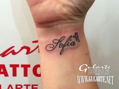 a woman's wrist tattoo with the word jola written in cursive writing