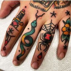 a person with tattoos on their hands and fingers