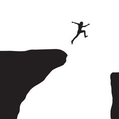 a person jumping off the edge of a cliff