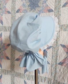 This pretty bonnet is suitable for most Historical events. Our poke bonnet features white eyelet lace around the brim and an adjustable back so that it will fit most head sizes. The brim is filled and quilted with a felt insert, so that it will stay stiff and not droop in the rain. The back of the bonnet has a curtain to protect the neck from sunburn. The bonnet is made from 100% cotton muslin in your choice of pastel color so can be machine washed. Properly taken care of, this item should provi Cotton Bonnet Cap, Adjustable Cotton Bonnet With Lace Trim, Adjustable Cotton Vintage Bonnet, Fitted Cotton Bonnet With Lace Trim, Adjustable Brimmed Cotton Bonnet, Poke Bonnet, White Eyelet, Pioneer Woman, Eyelet Lace