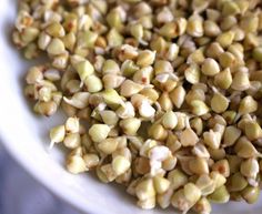 a white bowl filled with seeds on top of a table