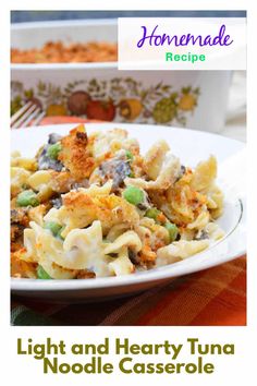 a white plate topped with pasta and vegetables