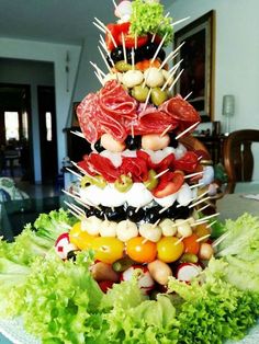 a christmas tree made out of vegetables and meats