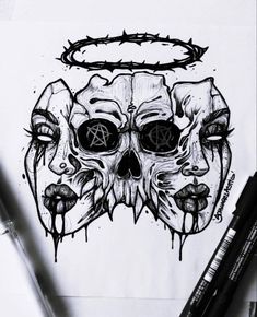 a drawing of two skulls with faces drawn on paper