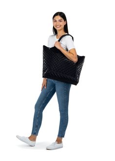 The Haute Shore Icon Night tote is a quilted puffer tote with large exterior slip pocket and interior zip and slip pockets. Ultra light weight. Large exterior slip pocket. Interior zip and slip pockets. Dimensions: 23" wide x 13.5" tall x 3.5" deep. Washable with mild soap. Hang dry. Casual Quilted Tote Shoulder Bag, Casual Black Quilted Bag, Casual Quilted Shoulder Bag For Shopping, Everyday Black Quilted Shoulder Bag, Black Quilted Shopping Bag, Black Quilted Shoulder Bag For Shopping, Modern Black Quilted Shoulder Bag, Modern Quilted Bag For Shopping, Modern Quilted Shopping Bag