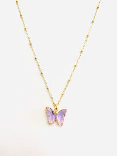 People view the butterfly as representing endurance, change, hope, and life. 18K Gold Plated CZ Stone 1 Inch Extender Tarnish-Free with Care Hypoallergenic Nickle and Lead Free Satellite Chain pictured Crystal Butterfly Necklace, Pretty Jewelry Necklaces, Preppy Jewelry, Crystal Butterfly, Purple Jewelry, Green Butterfly, Purple Crystal, Jewelry Lookbook, Purple Butterfly