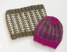 two knitted hats sitting next to each other