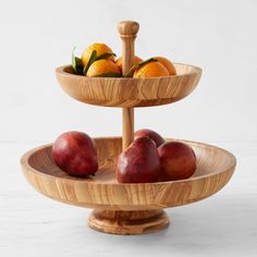 three tiered wooden tray with fruit on it