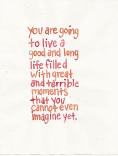 the words are written in red and orange ink on white paper, which reads you are going to live a good and long life filled with great moments that you cannot change yet