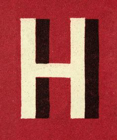 the letter h is painted in black, white and red