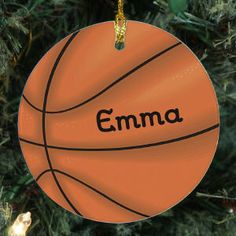 a basketball ornament hanging from a christmas tree