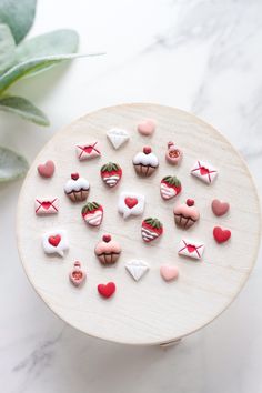 a white plate topped with lots of different types of candies on top of a table