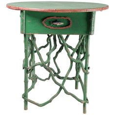 an old green table with a fish on it