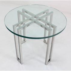 a glass table with metal legs on a white background